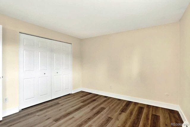 6640 S Dexter St, Centennial, CO 80121 - unfurnished bedroom featuring wood finished floors and a closet