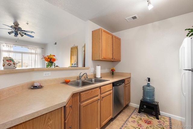 kitchen with light tile patterned flooring, dishwasher, sink, white fridge, and ceiling fan