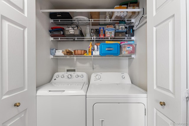 laundry area featuring washing machine and clothes dryer