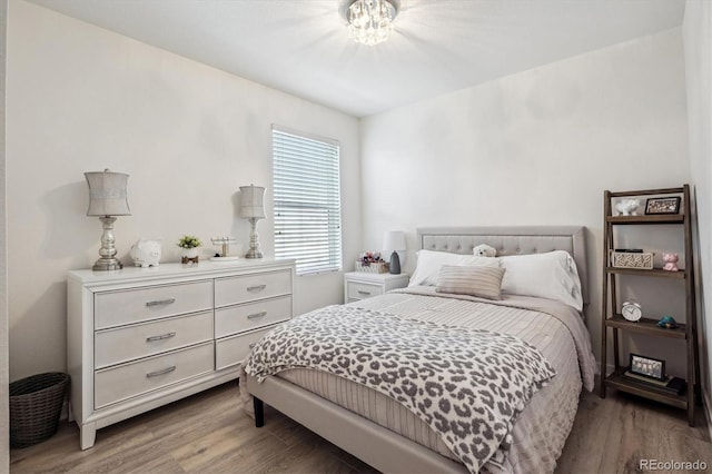 bedroom featuring wood-type flooring