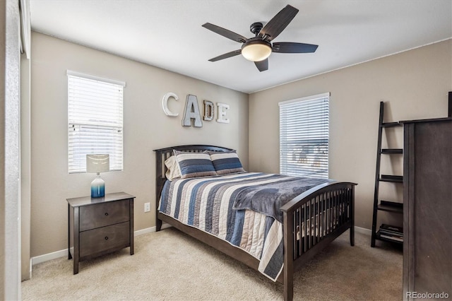 bedroom with light colored carpet and ceiling fan