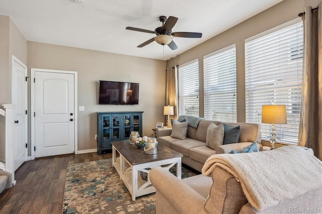 living room with dark wood-type flooring and ceiling fan