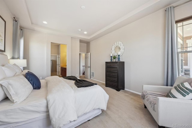 bedroom featuring baseboards, recessed lighting, a raised ceiling, and light colored carpet