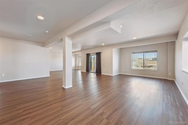 unfurnished living room featuring baseboards, recessed lighting, and dark wood-style flooring