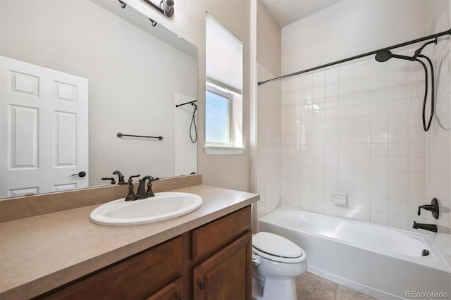 full bath featuring toilet, vanity, and shower / tub combination