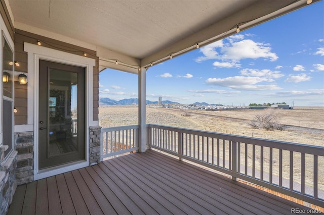 wooden terrace with a mountain view