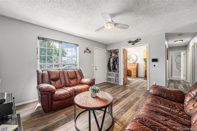 9354 Field Ln, Broomfield, CO 80021 - living room with wood finished floors, a ceiling fan, and a textured ceiling