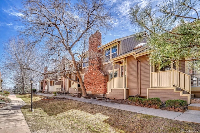 view of front of house featuring a residential view and a chimney