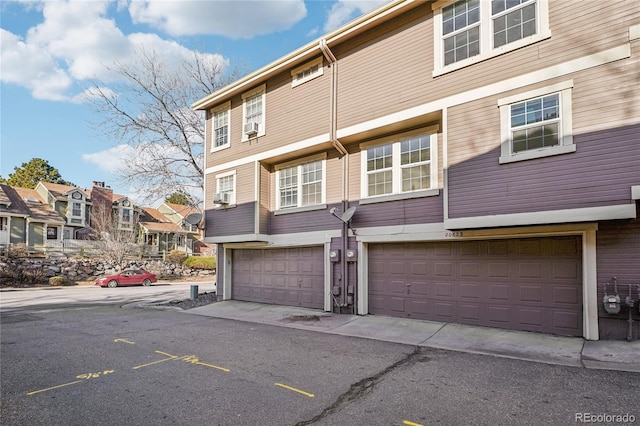 view of front of home featuring a residential view and a garage