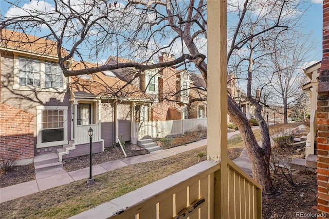 exterior space with fence and a chimney