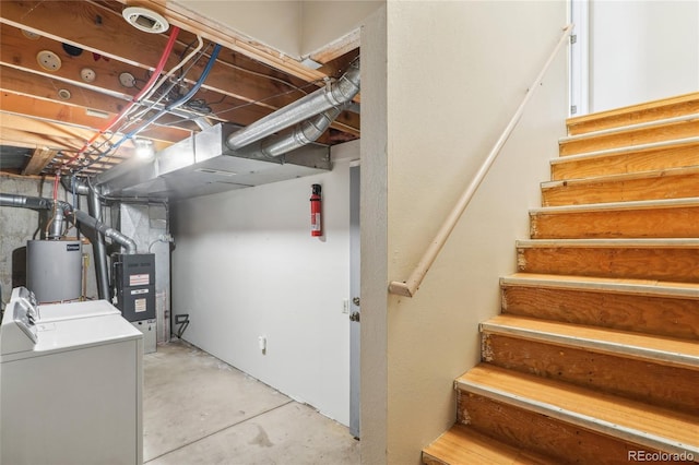 unfinished below grade area featuring water heater, stairs, and heating unit