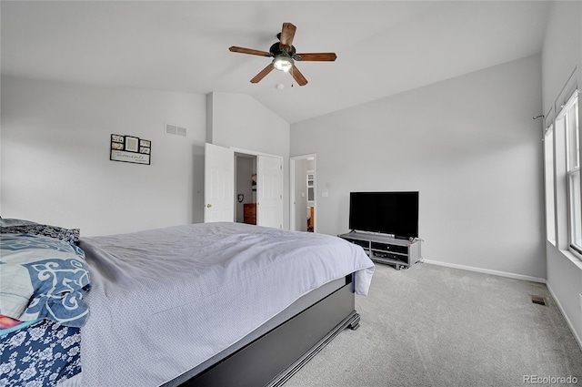 carpeted bedroom featuring vaulted ceiling and ceiling fan