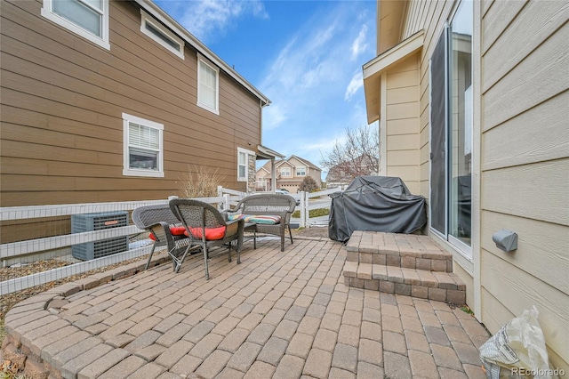 view of patio / terrace featuring area for grilling and central air condition unit