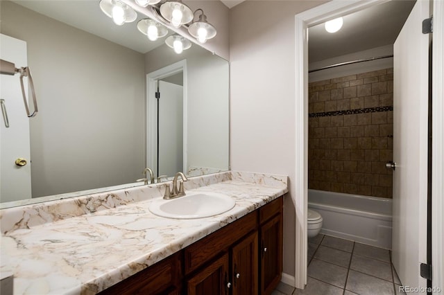 full bathroom featuring toilet, tiled shower / bath combo, vanity, and tile patterned floors