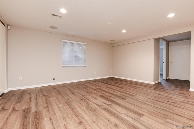 spare room featuring light wood-type flooring