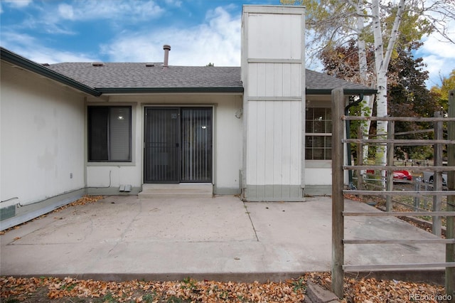 entrance to property featuring a patio