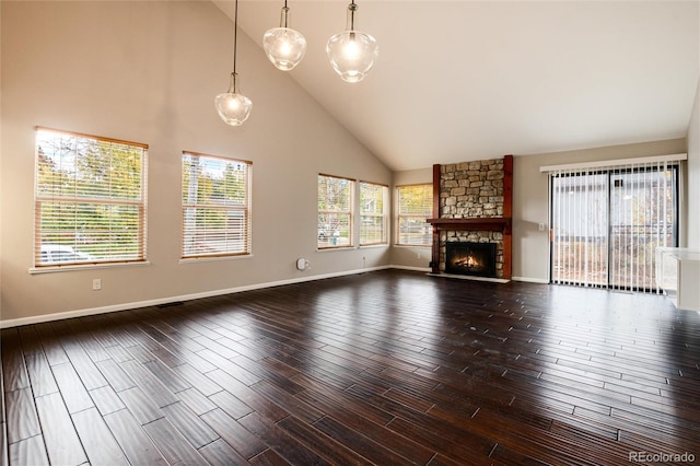 unfurnished living room featuring a fireplace, high vaulted ceiling, and hardwood / wood-style floors