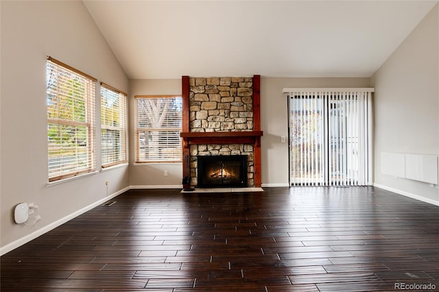 unfurnished living room with a fireplace, lofted ceiling, dark hardwood / wood-style floors, and radiator