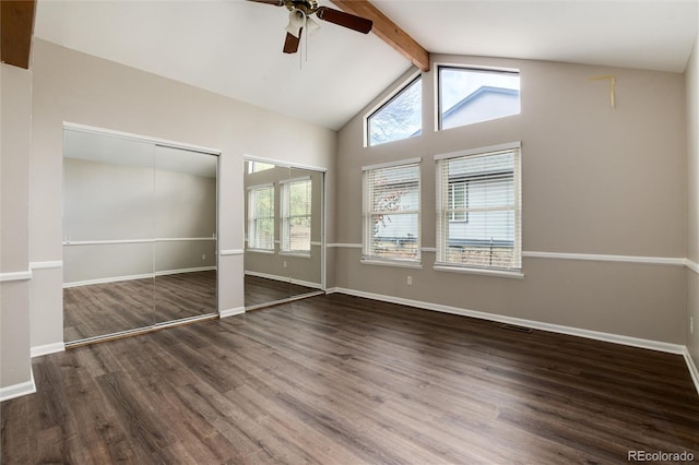 unfurnished bedroom featuring beamed ceiling, multiple windows, ceiling fan, and dark hardwood / wood-style floors