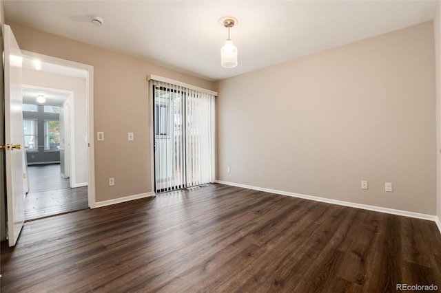 empty room featuring dark hardwood / wood-style floors