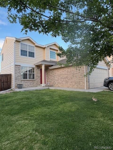 18897 E Linvale Pl, Aurora, CO 80013 - view of front of house with brick siding and a garage