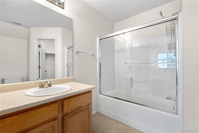 18897 E Linvale Pl, Aurora, CO 80013 - bathroom with vanity, bath / shower combo with glass door, and toilet