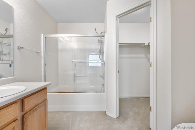 18897 E Linvale Pl, Aurora, CO 80013 - full bath with vanity, combined bath / shower with glass door, a walk in closet, and toilet