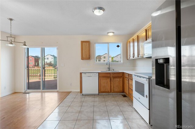 18897 E Linvale Pl, Aurora, CO 80013 - kitchen with white appliances, a sink, plenty of natural light, and light countertops