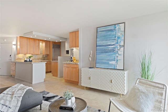 living room with light tile patterned floors and recessed lighting