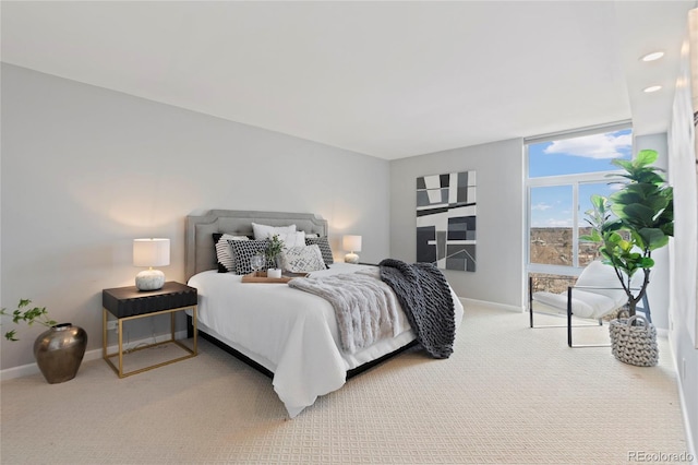 carpeted bedroom with baseboards