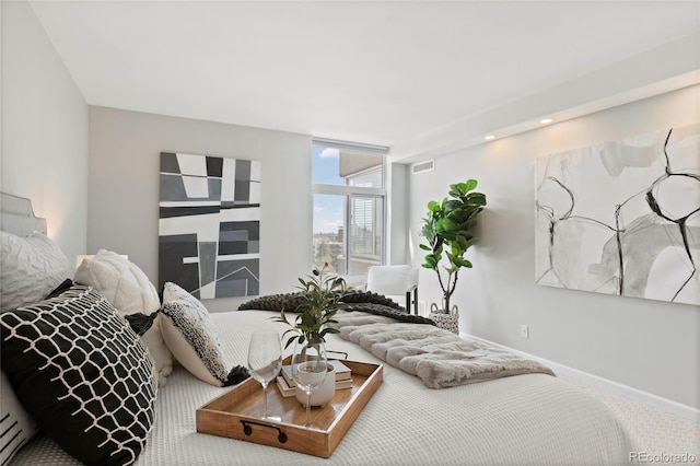 bedroom with visible vents and baseboards