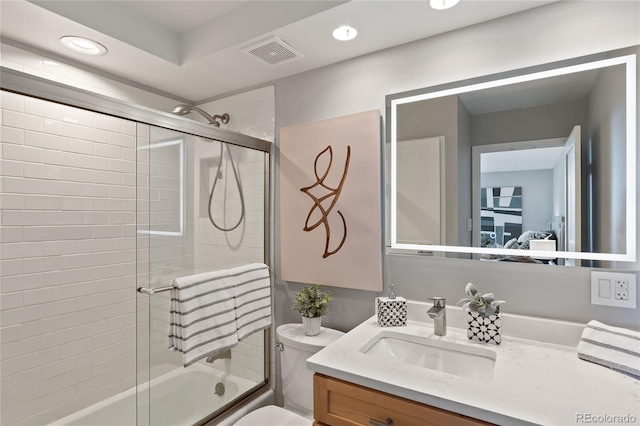 full bath featuring vanity, visible vents, recessed lighting, toilet, and combined bath / shower with glass door