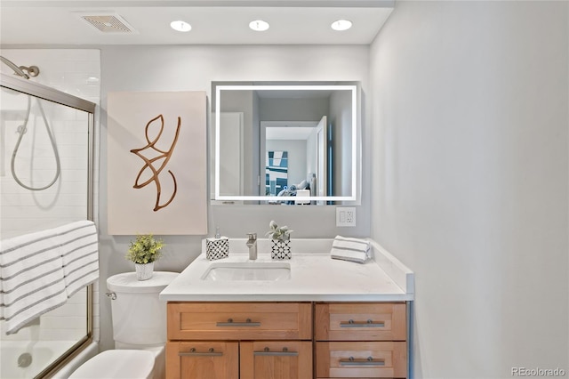 full bathroom with combined bath / shower with glass door, visible vents, toilet, and vanity