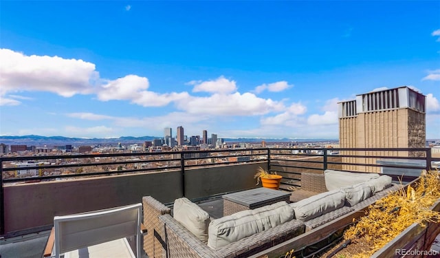 view of patio / terrace with a view of city, outdoor lounge area, and a balcony