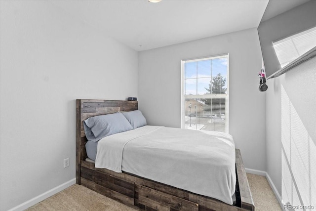 bedroom featuring light colored carpet