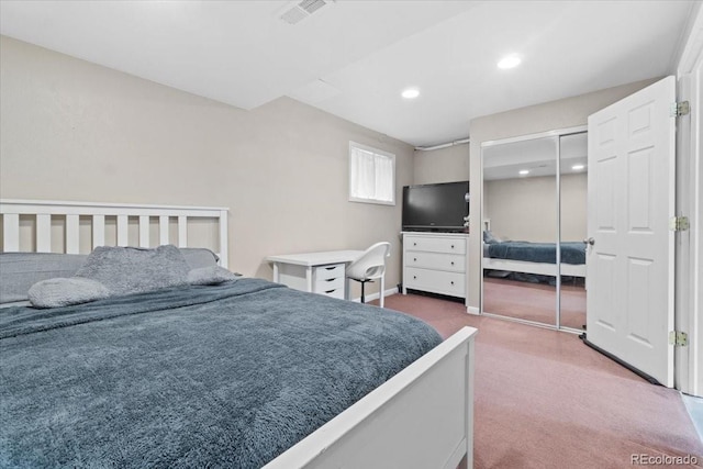 carpeted bedroom featuring a closet