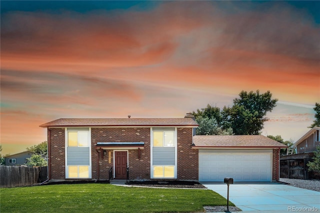 10932 W 107th Ave, Broomfield, CO 80021 - view of front of home featuring an attached garage, driveway, and brick siding