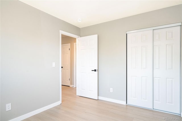 10932 W 107th Ave, Broomfield, CO 80021 - unfurnished bedroom with light wood-type flooring and a closet