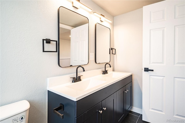 10932 W 107th Ave, Broomfield, CO 80021 - bathroom featuring double vanity and tile patterned flooring