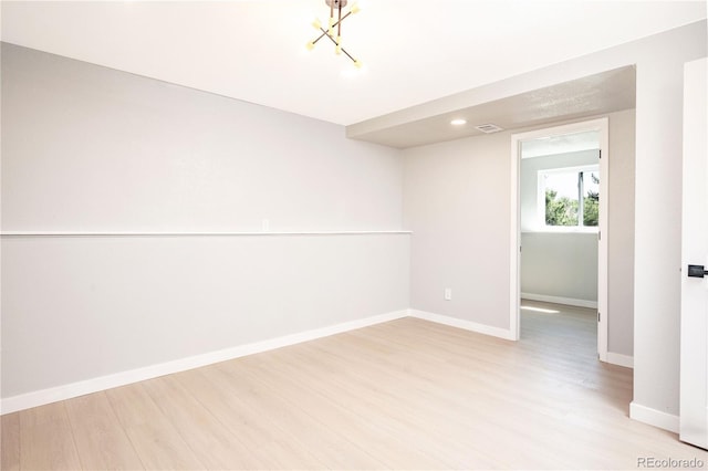 10932 W 107th Ave, Broomfield, CO 80021 - spare room featuring light wood-style floors, a chandelier, and recessed lighting