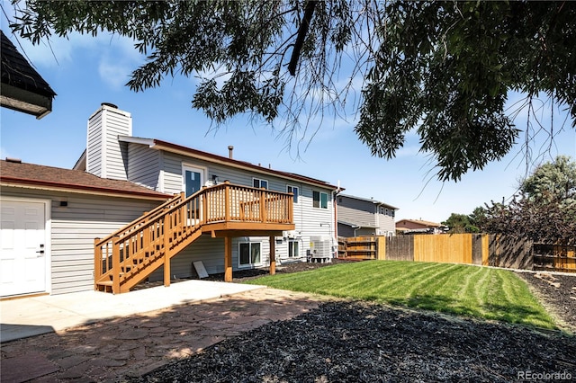 10932 W 107th Ave, Broomfield, CO 80021 - rear view of property featuring a deck, a chimney, a patio area, and stairway