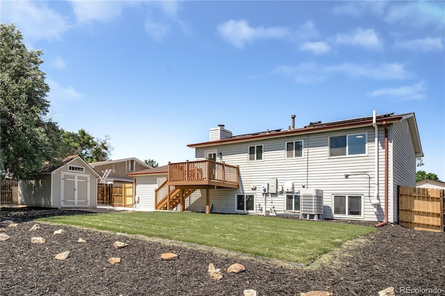 10932 W 107th Ave, Broomfield, CO 80021 - rear view of property with a storage shed, stairs, a wooden deck, and a chimney