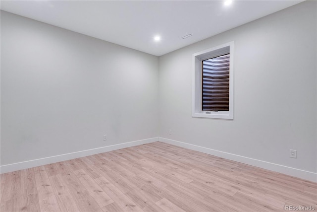 unfurnished room with light hardwood / wood-style flooring