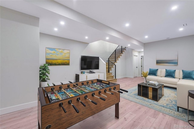 living room with light hardwood / wood-style flooring