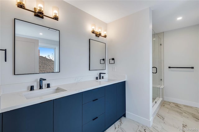 bathroom featuring vanity and a shower with door