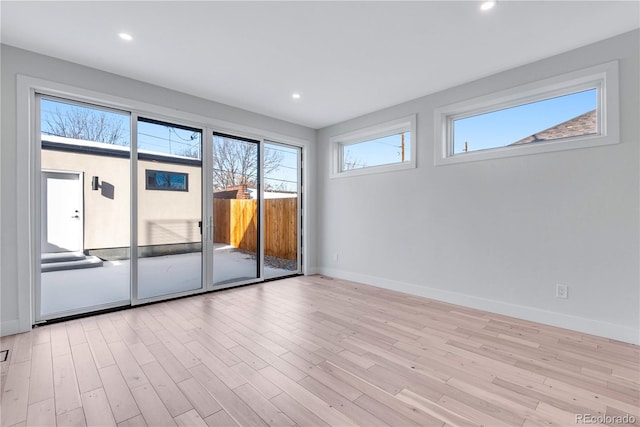 unfurnished room featuring light hardwood / wood-style floors