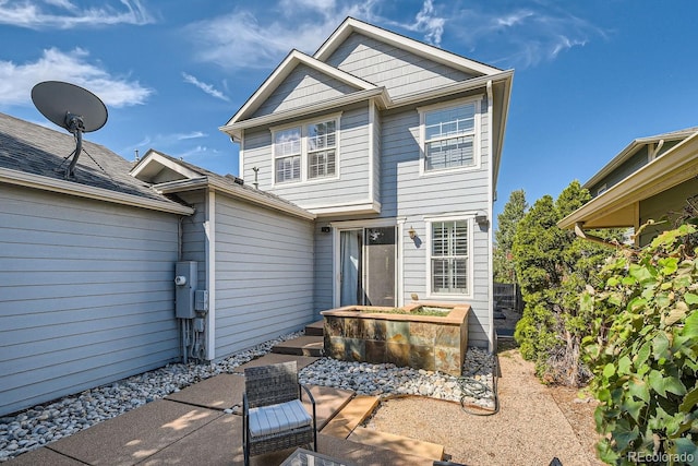 rear view of property with a patio