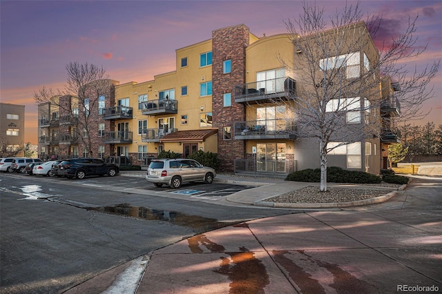 9039 E Panorama Cir Unit C201, Englewood, CO 80112 - property at dusk with uncovered parking