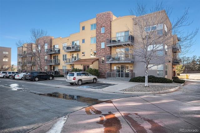 9039 E Panorama Cir Unit C201, Englewood, CO 80112 - view of apartment building / complex with uncovered parking