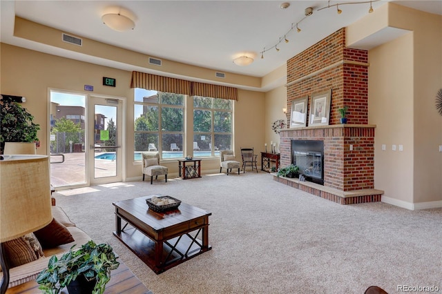 9039 E Panorama Cir Unit C201, Englewood, CO 80112 - living room with carpet floors and a fireplace